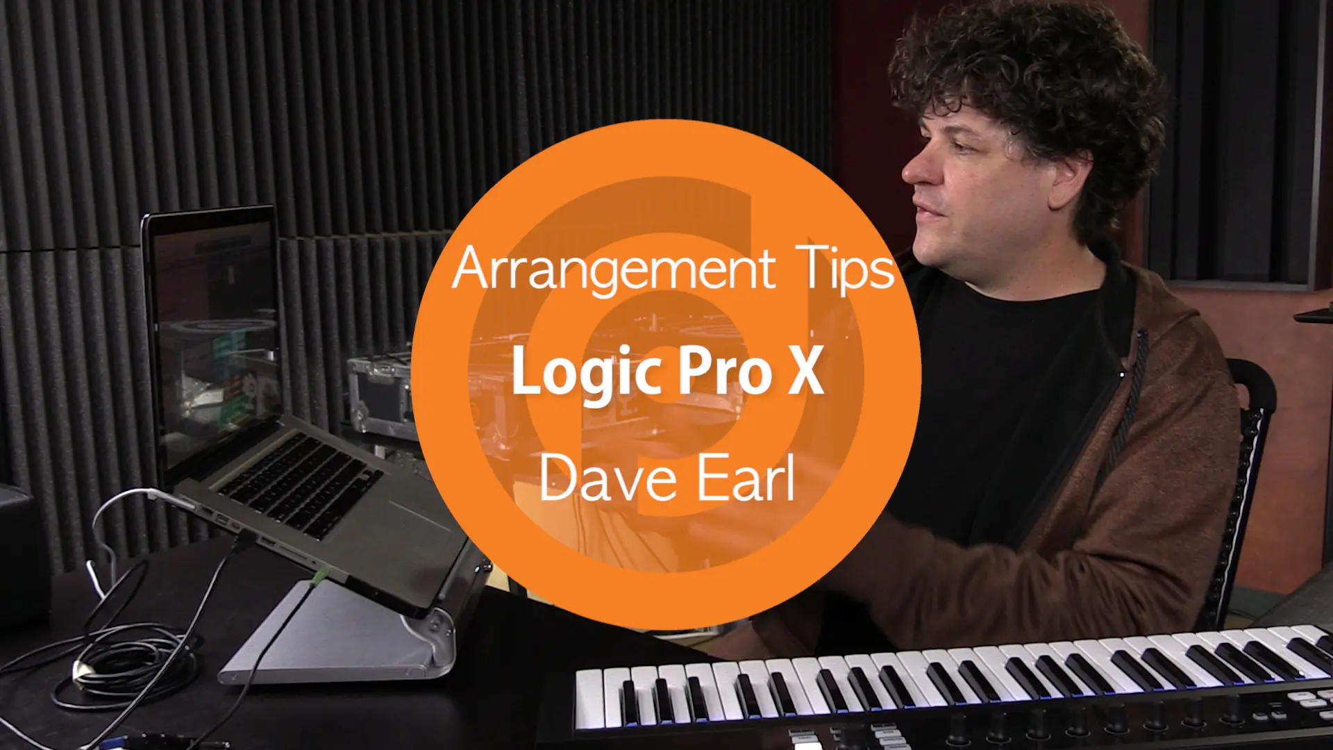 A music producer in front of a keyboard with the words arrangement tips Logic Pro X.